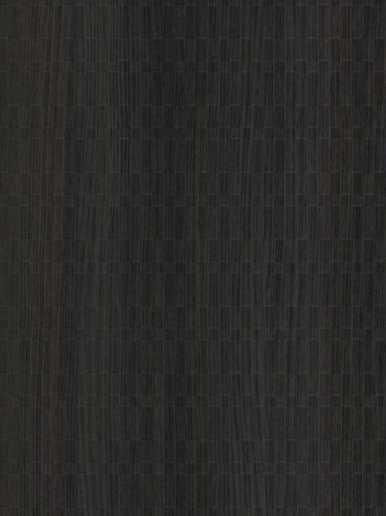 Detailafbeelding van decoratief plaatmateriaal waarin een zwart houtdecor is gecombineerd met een geometrische structuur