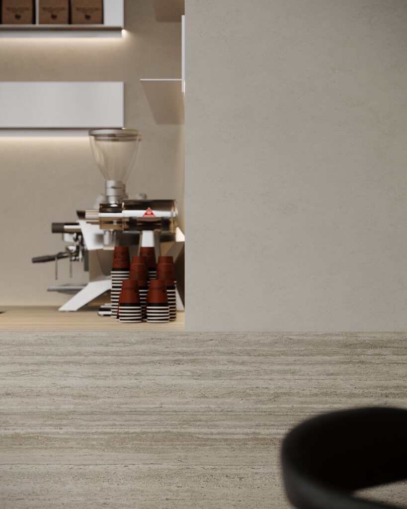 Detailafbeelding van een bar uitgewerkt in plaatmateriaal FD01 Taranta van Cleaf, welke de beleving van travertin heeft. De wandafwerking uitgewerkt in een zandkleurig decor FD10 Taranta van Cleaf.