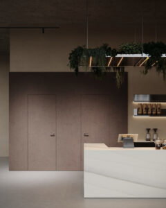 Een render van een horecagelegenheid met een bar uitgewerkt in het solid surface decor DM5048 Starstruck van Durasein, welke de luxe uitstraling van marmer op een warm witte basis biedt. De wandafwerking uitgewerkt in de FD29 Taranta van Cleaf, welke de beleving van zandsteen geeft, en een deur in de FD14 Taranta van Cleaf, een bruine steentextuur.