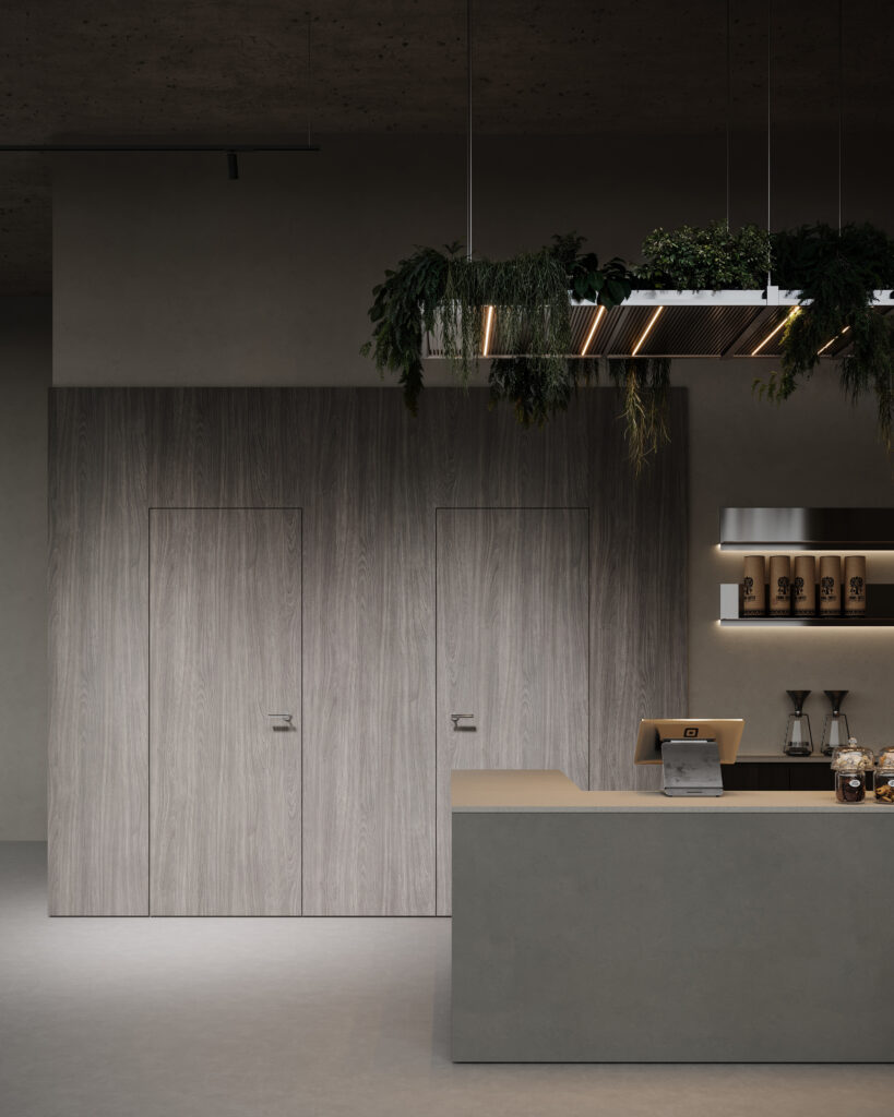 Een render van een horecagelegenheid met een bar uitgewerkt in het donkergrijze plaatmateriaal FD16 Taranta van Cleaf in combinatie met een blad uitgewerkt in het gekorrelde solid surface decor TS053 Old Castle van Durasein. De wandafwerking uitgewerkt in het lichtgrijze decor FD16 Taranta van Cleaf met een deur in de S212 Corteccia, welke de beleving van gerookt grijs kastanjehout biedt.