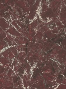 Detailafbeelding van decoratief plaatmateriaal waarin een donkerrood natuursteendecor is ter zien, de FD42 Fiocco van Cleaf.