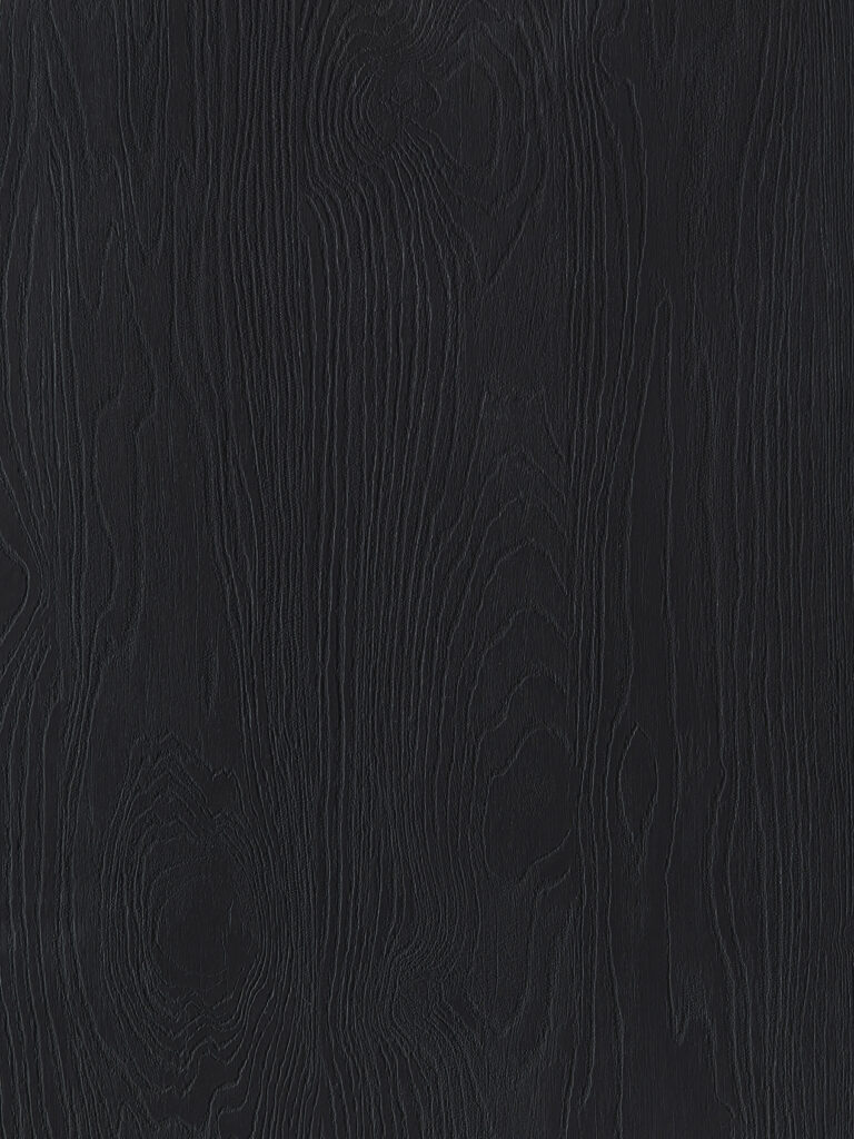 Detailafbeelding van decoratief plaatmateriaal met een donkere houtlook, de U129 Bruciato van Cleaf.
